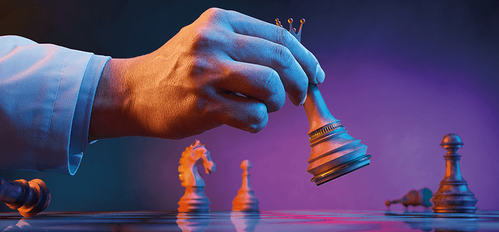 Hand moving a chess piece, banner