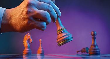Hand moving a chess piece, banner