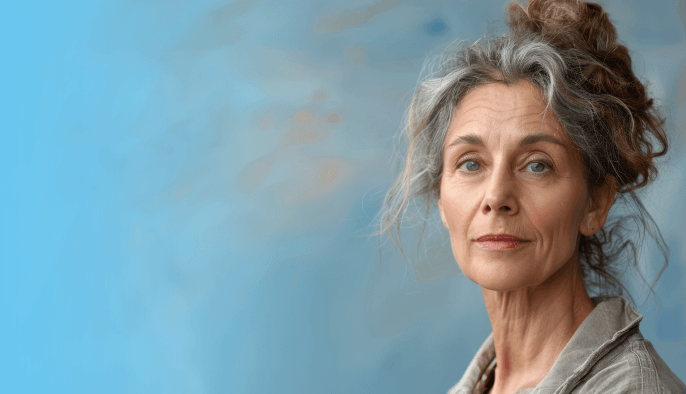 A woman (hypothetical patient) with gray and brown hair